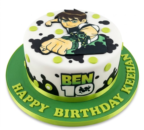 Round white and green Ben 10 themed birthday cake with Ben Tennyson character and black splatters.