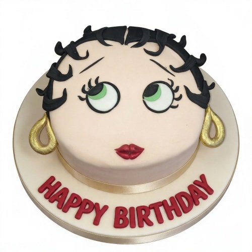 Round Betty Boop face birthday cake with black hair, green eyes, red lips, gold earrings, and 'Happy Birthday' in red text.