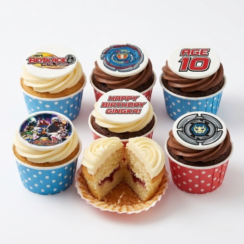 Beyblade themed birthday cupcakes with various character and spinning top toppers, including a custom age topper.