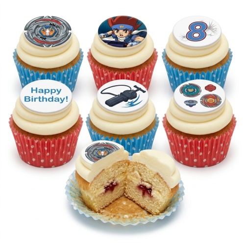 Beyblade themed cupcakes with character, launcher, and spinning top toppers, in red and blue polka dot wrappers.