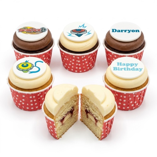 Beyblade themed birthday cupcakes with spinning top toppers and personalised message.