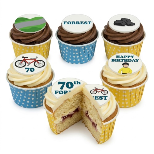 A selection of cycling theme birthday cupcakes with bike, cyclist, and hill toppers, some with custom age and name.