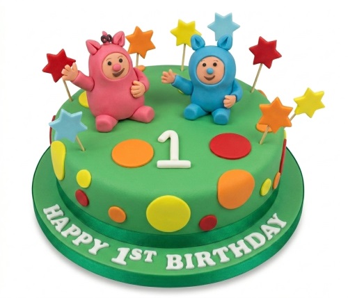 Round green 1st birthday cake with pink and blue characters, number one, and colourful stars and polka dots.