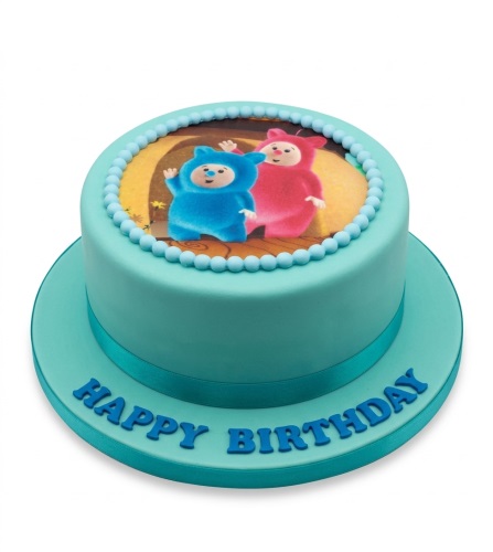 Round teal birthday cake with edible cartoon characters and "Happy Birthday" message.