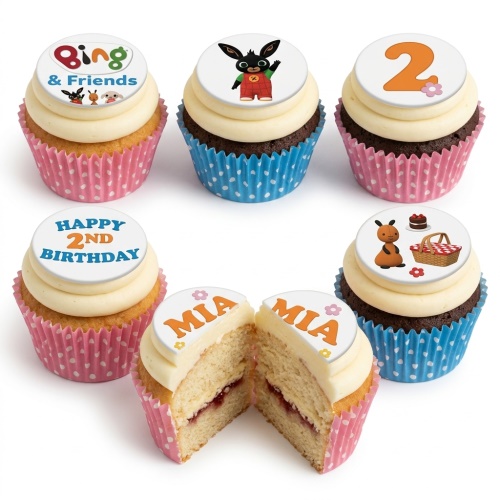 Bing Bunny themed cupcakes with white frosting, pink and blue wrappers, and custom age/name toppers.
