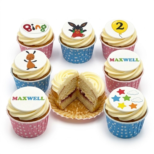 Set of Bing Bunny themed cupcakes with white frosting, pink and blue polka dot cases, and edible toppers including Bing, Flop, Bing logo, colourful stars and clouds, a yellow balloon with the number 2, and the name MAXWELL.