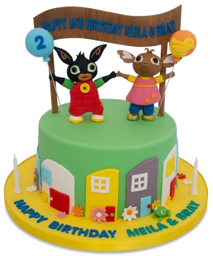 Round green Bing Bunny birthday cake with Bing and Flop figurines, custom age balloon, and colourful houses.