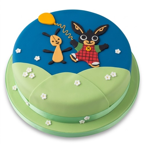 Round two-tier Bing Bunny and Flop birthday cake with blue sky, green hills, yellow balloon, and white flowers.