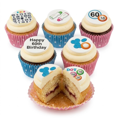 A selection of Bingo themed cupcakes with white frosting, featuring edible toppers with Bingo cards, dabbers, and numbers, and a custom age message.