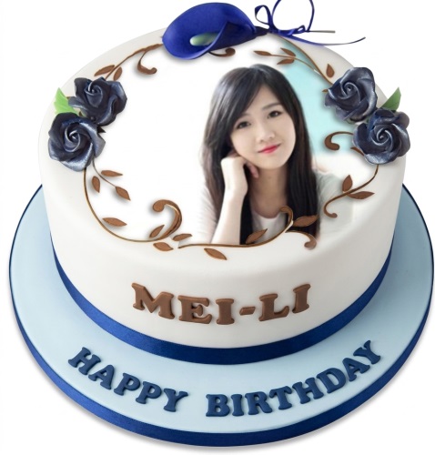Round white personalised photo birthday cake with dark blue roses, brown vines, and a blue calla lily.