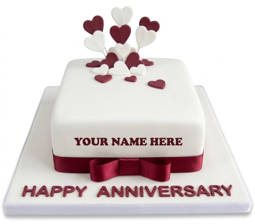 White square anniversary cake with red and white heart decorations, a red ribbon bow, and a custom message.