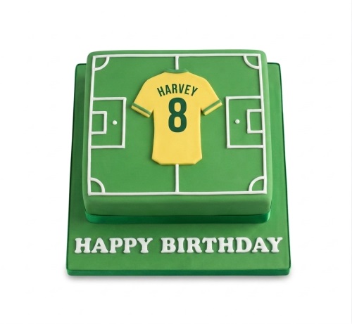 Two-tiered square football pitch birthday cake with a yellow personalised jersey and custom number.