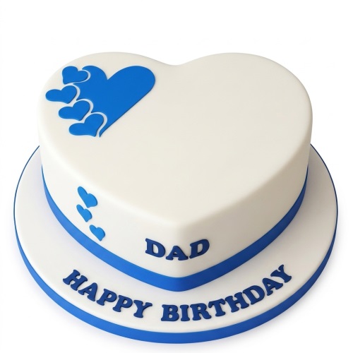 White heart-shaped birthday cake with blue hearts and a personalised message on the board.