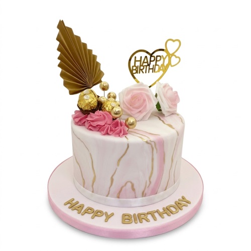 Round elegant birthday cake with pink marble, gold accents, roses, and 'Happy Birthday' topper.