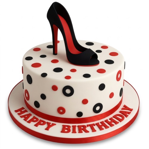 Round white birthday cake with black and red polka dots, topped with a black high heel shoe with a red sole, and 'Happy Birthday' on the board.