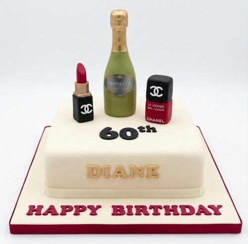 Square cream birthday cake with edible Prosecco bottle, red lipstick, and nail polish decorations, with custom age and name.