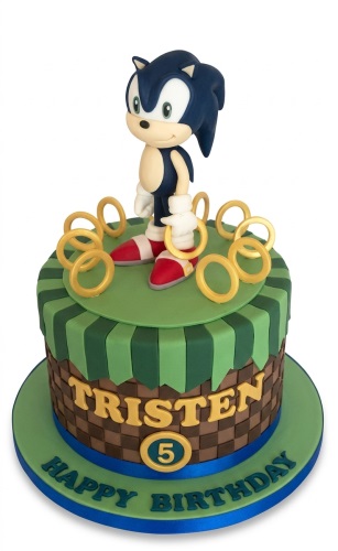 Two-tier Sonic Hedgehog birthday cake with character topper, golden rings, custom name, and age emblem.