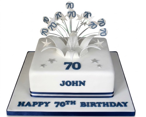 White 70th birthday cake with navy blue '70' and star topper, personalised name.