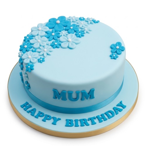 Round light blue birthday cake with cascading blue and white sugar flowers and a blue ribbon.