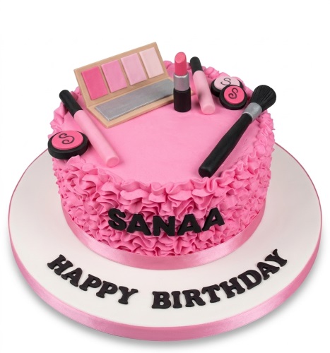 Round pink birthday cake with edible makeup decorations and ruffled frosting, with a custom name and message.