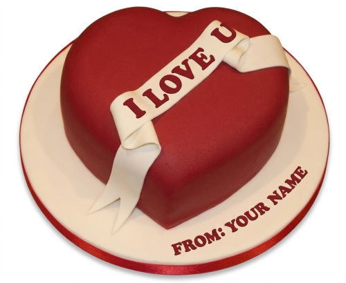 Red heart-shaped cake with 'I LOVE U' ribbon and personalised message.