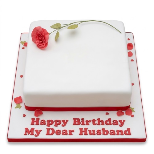 White square birthday cake with a single red rose, green leaves, and red ribbon on a white board with red text.