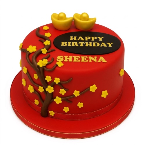 Red birthday cake with yellow flowers, brown tree branch, and golden ingot toppers.