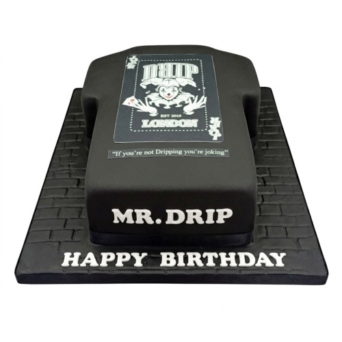 Black Drip London theme birthday cake with white text and a joker playing card logo.