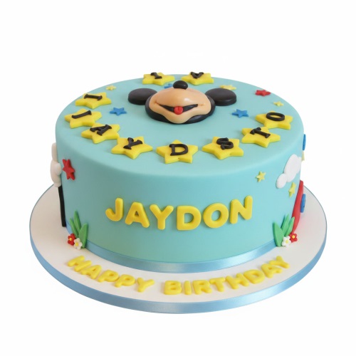 Light blue Mickey Mouse birthday cake with yellow stars, personalised name, and "Happy Birthday" message.