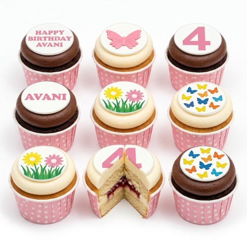Assortment of butterfly and floral themed birthday cupcakes for girls with custom age and personalised name toppers.