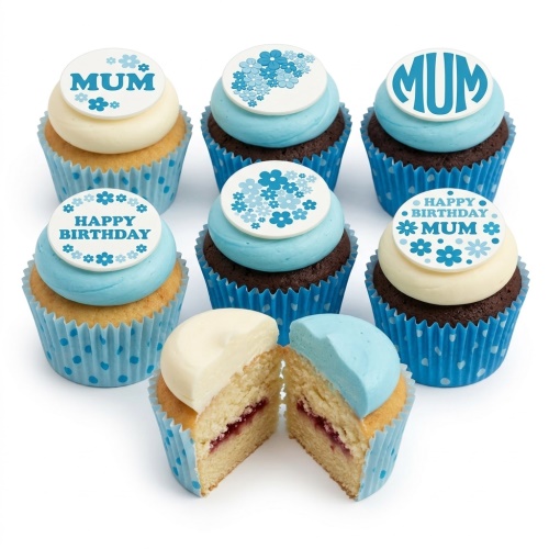 Set of floral themed birthday cupcakes with blue and white frosting and edible toppers, some with 'MUM' and 'Happy Birthday' messages.