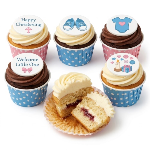 Cupcakes with white frosting and edible toppers featuring "Happy Christening", "Welcome Little One", baby shoes, baby grow, and celebration elements in blue and pink wrappers.