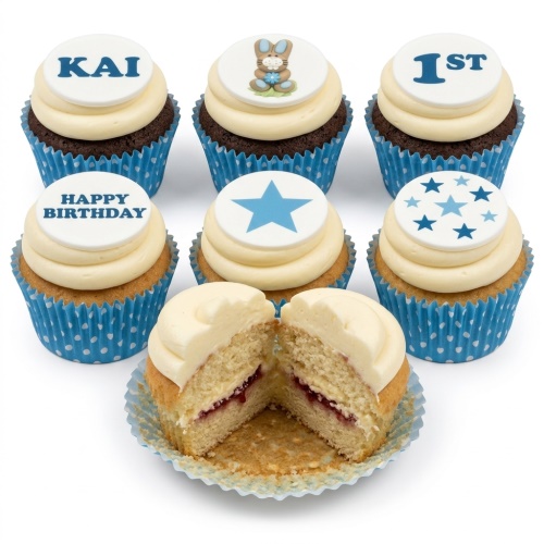 Blue and white cupcakes with bunny, stars, and '1ST' and 'Happy Birthday' toppers, in blue polka dot cases.