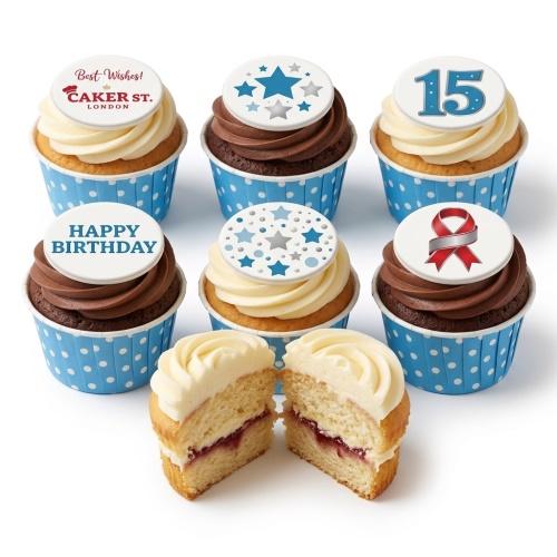 A selection of custom age birthday cupcakes with star and ribbon toppers, some showing the number 15 and "Happy Birthday" text, in blue polka dot cases.