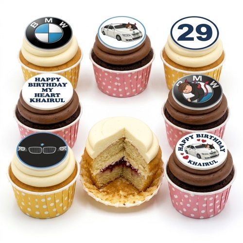 A collection of BMW themed birthday cupcakes with various car and logo toppers, some with custom age and message.