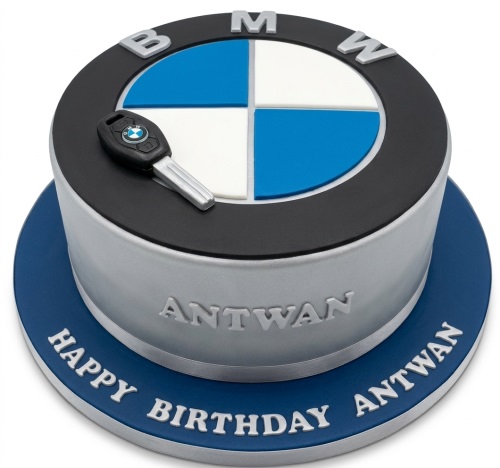 Round BMW logo birthday cake with an edible car key and personalised name.