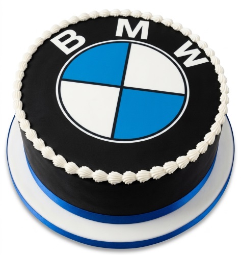 Round black cake with white piping and a large edible BMW logo on top, with a blue ribbon around the base.