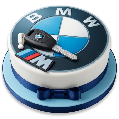 Round white BMW themed birthday cake with a blue logo, car key, and M badge, tied with a blue ribbon.