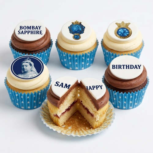 Six Bombay Sapphire branded cupcakes with chocolate and vanilla frosting, blue polka dot cases, and custom message toppers.