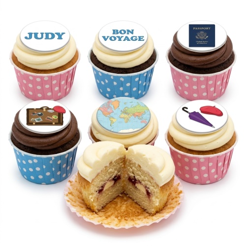 Cupcakes with travel-themed edible toppers including world map, passport, suitcase, and "Bon Voyage" message.