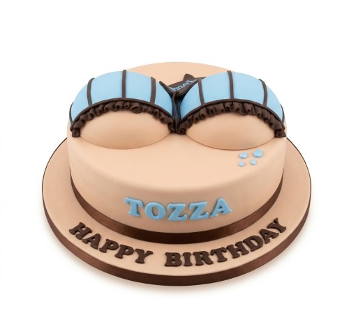 Novelty birthday cake shaped like a bust with a blue bikini top and custom message.