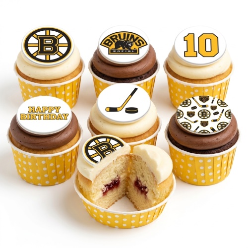 Ice hockey themed cupcakes with custom age topper, hockey stick, puck, and team-inspired designs in yellow, black, and white.