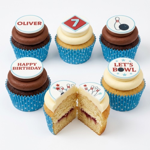 Bowling themed birthday cupcakes with pins, ball, 'Let's Bowl', 'Happy Birthday', 'Oliver', and custom age '7' toppers.