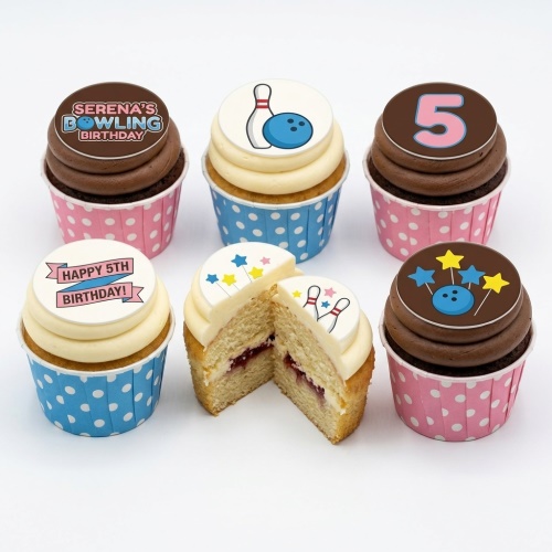 Set of bowling themed birthday cupcakes with bowling pins, balls, and stars, featuring custom age toppers.