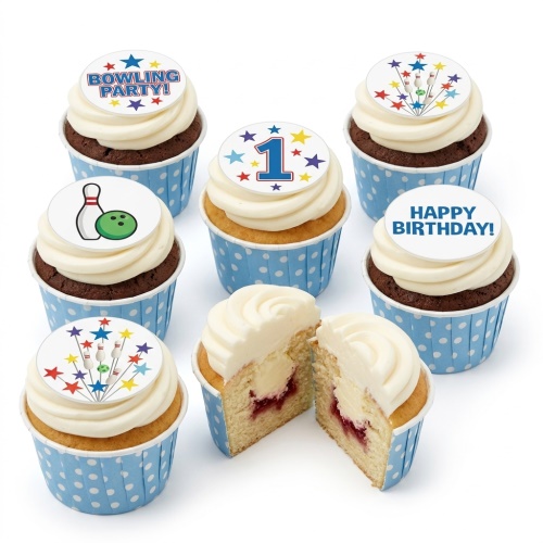 Assortment of bowling themed birthday cupcakes with edible toppers, including bowling pins, a ball, stars, and a number 1.