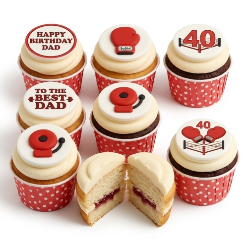 Set of boxing themed birthday cupcakes with red and white toppers, including boxing gloves, a boxing ring, and a gym bell.