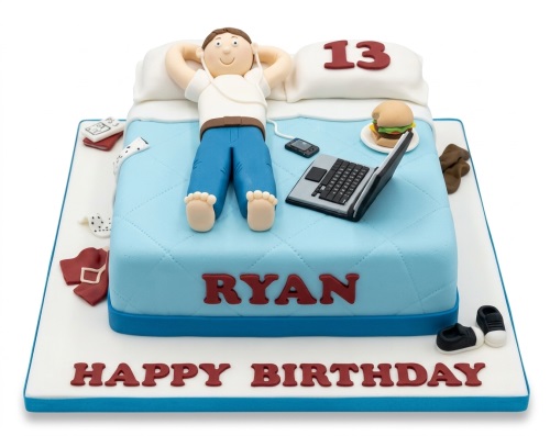 Light blue bed cake with a boy, laptop, phone, burger, and custom age topper.