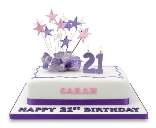 White square birthday cake with purple ribbon, star toppers, and custom age candles.