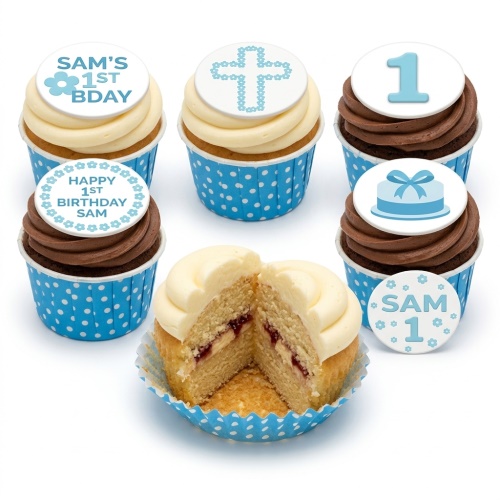 Blue and white 1st birthday cupcakes for boys with number one, gift box, and cross toppers.