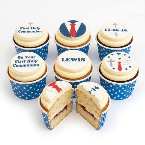 Holy Communion cupcakes with suit and cross toppers, blue polka dot wrappers, and customisable name/date.